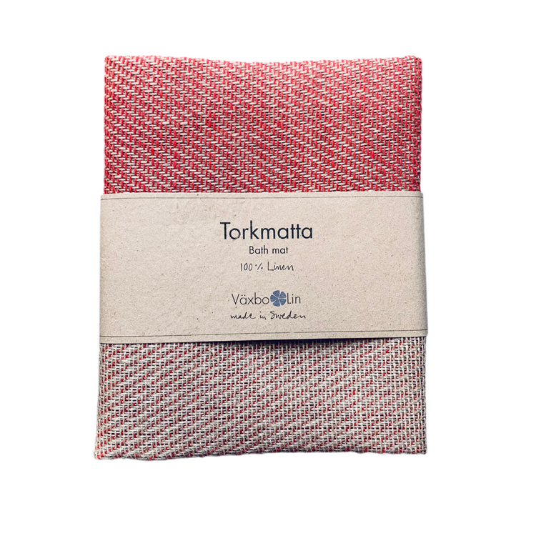 Badvorleger Leinen Tirkmatta in rot zusammengwfaltet mit Banderole
