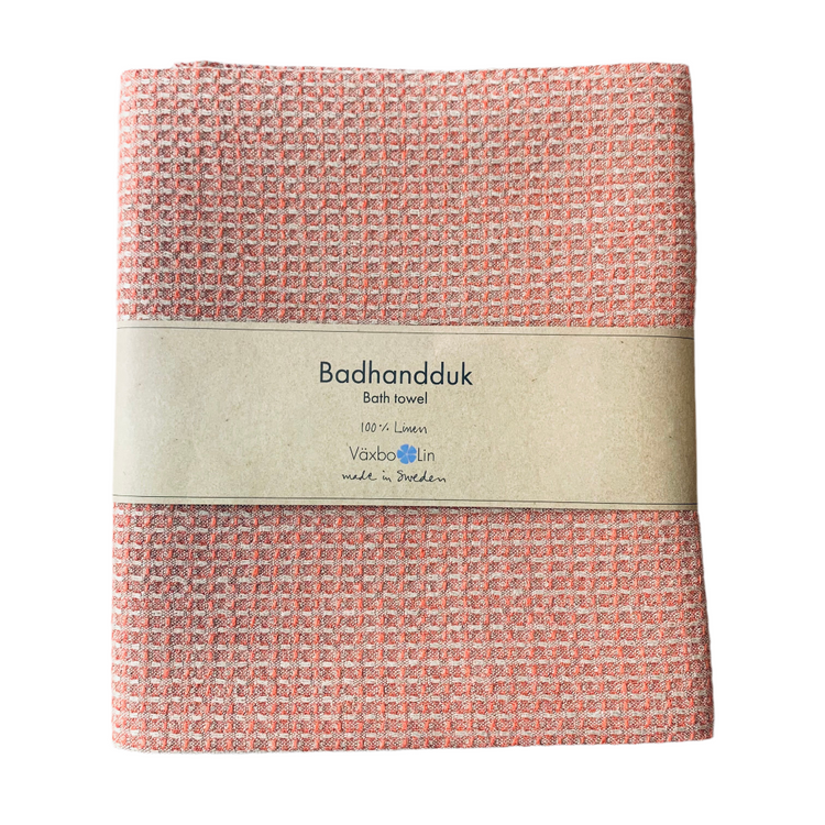 Badetuch Bubbel aus Leinen in ziegelrot zusammengefaltet mit Banderole