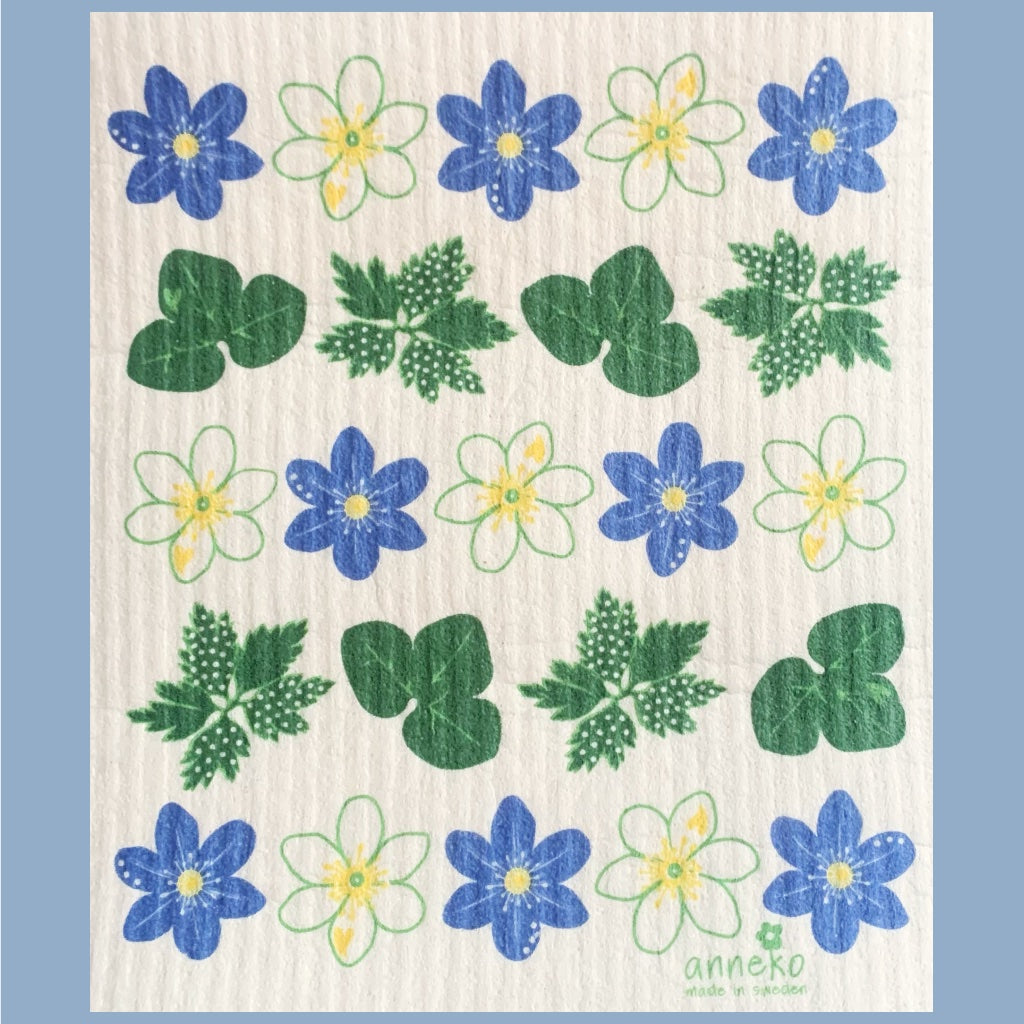Blüten von illustrierten Buschwindröschen und Leberblümschen abwechselnd in Reihen, daziwschen Reihen mit Blättern in grün, unten steht das Logo von Anneko