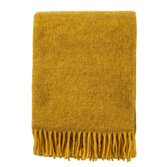 gelbe Gotlanddecke zusammengefaltet, man sieht schön die Graumelierung, das Gelb ist nicht schreiend