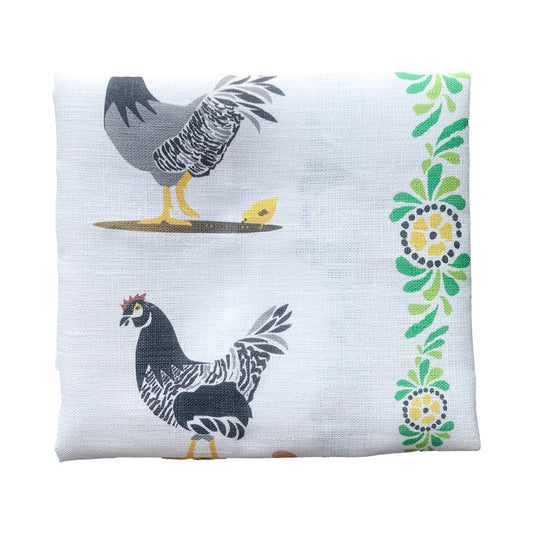 Handtuch GalLina zusammengefaltet, man sieht die schöne gelb-grüne Kante und ein braunes Huhn