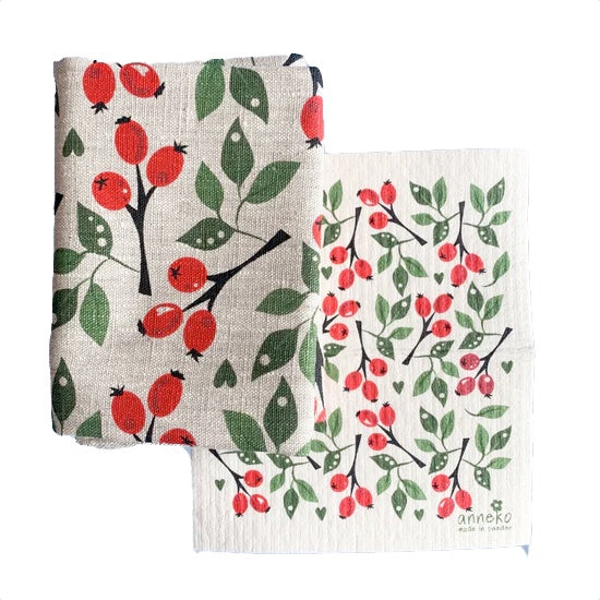 Set Handtuch und Schwammtuch mit Hagebutten halb aufeinander liegend