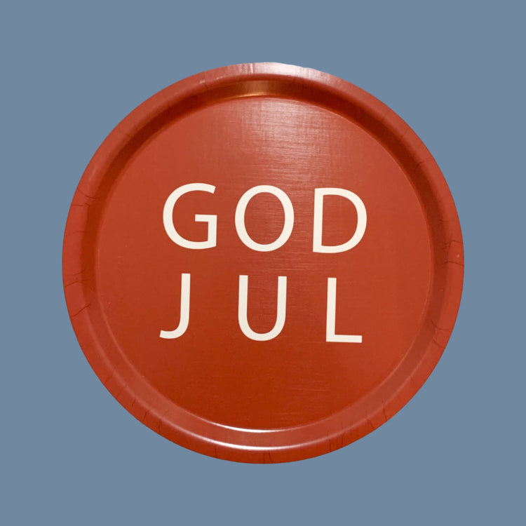 rundes Tablett in rot mit weißer Aufschrift God Jul