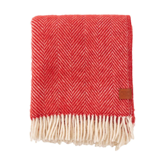 Wolldecke Herringbone rot zusammengefaltet mit Fransen