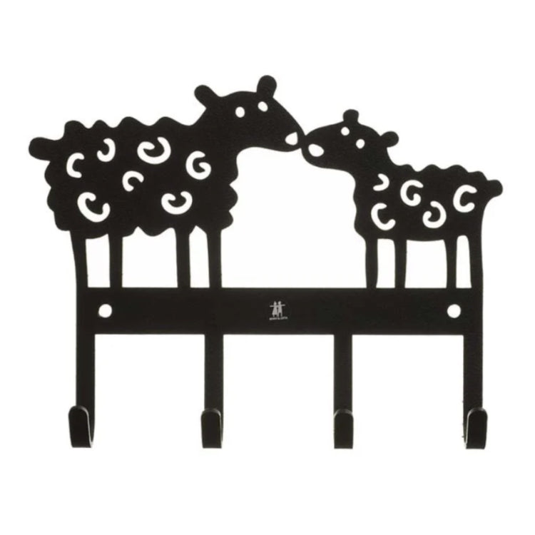 zwei ausgestanzte Schafe, die sich einander zuwenden und mit den Nasen anstipsen, Beine stehen auf einer Leiste mit vier Haken