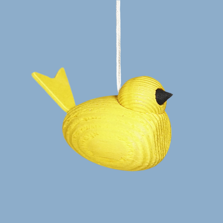 Vogel aus Holz mit Band in gelb