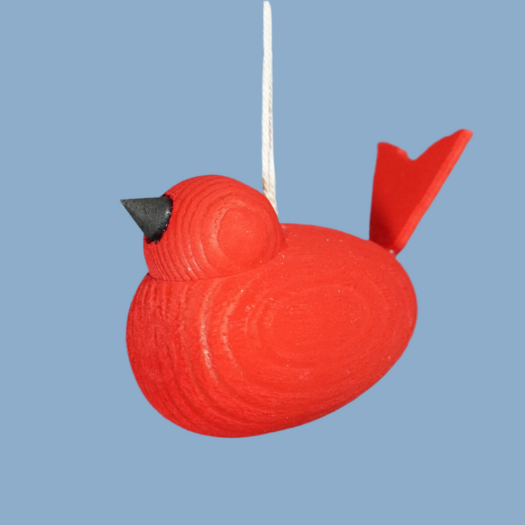 Vogel aus Holz mit Band in rot