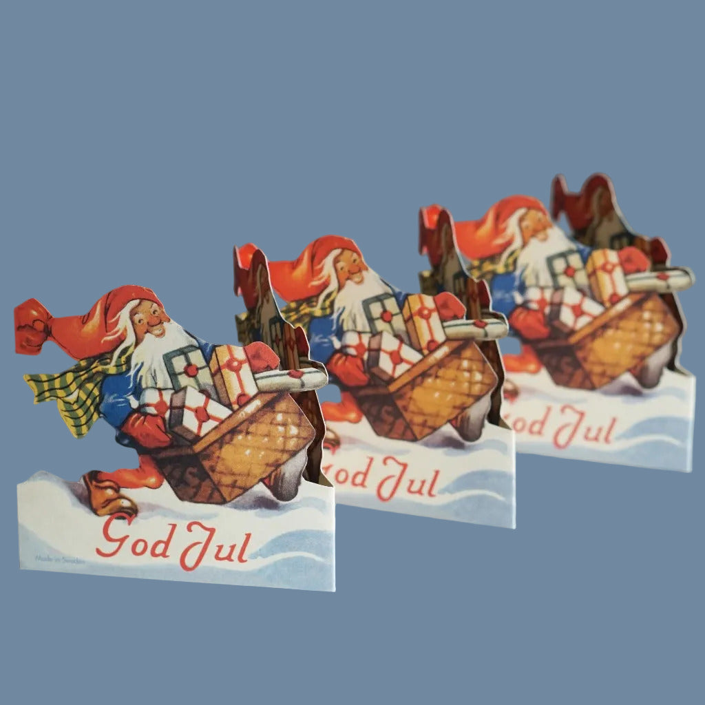 Leporello Tomte God Jul vor mysblauem Hintergrund
