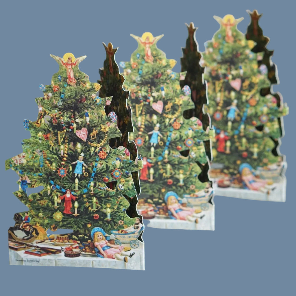 Leporello Weihnachtsbaum aufgestellt vor mysblauem Hintergrund
