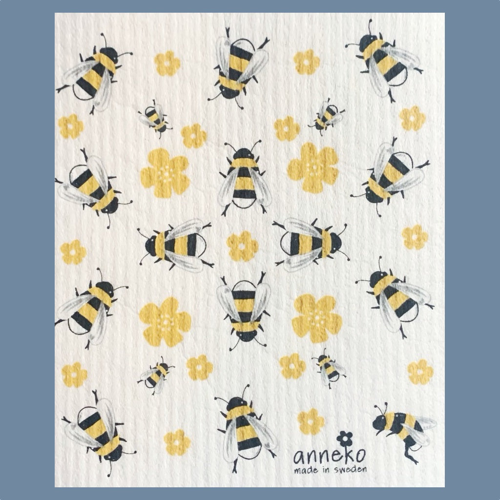 Große und kleine illustrierte Bienen in gelb und schwarz sind durcheinander auf dem Schwammuch verteilt, dazwischen einige gelbe Blüten