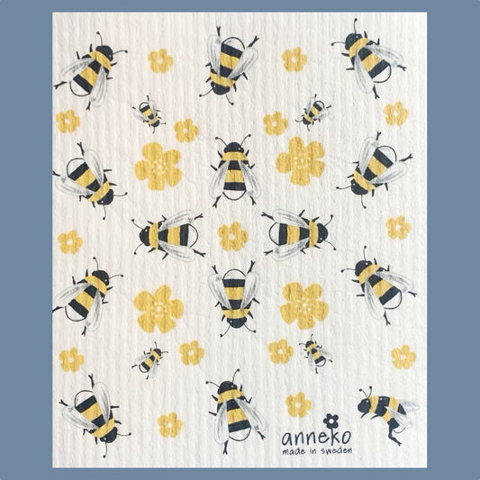 Große und kleine illustrierte Bienen in gelb und schwarz sind durcheinander auf dem Schwammuch verteilt, dazwischen einige gelbe Blüten