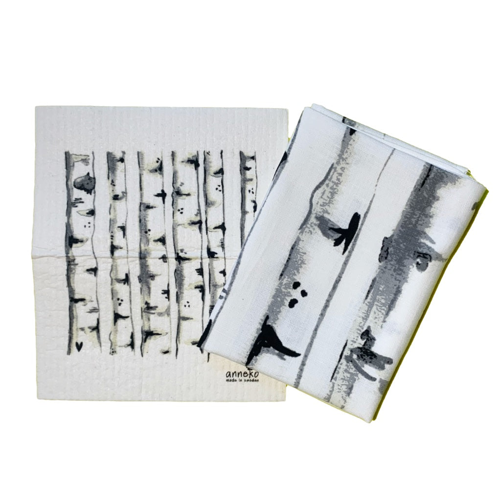 Schwammtuch und Handtuch mit Design Birken nebeneinanderliegend