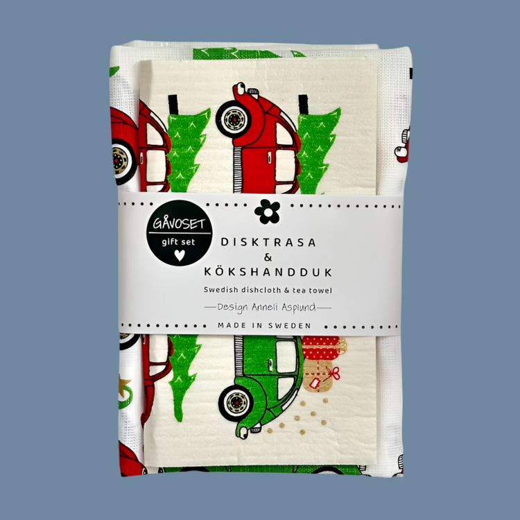 Geschenkset Handtuch + Schwammtuch mit Motiv rotes Auto mit grünem Weihnachtsbaum aufm Dach, Set ist zusammengfaltet und mit Banderole