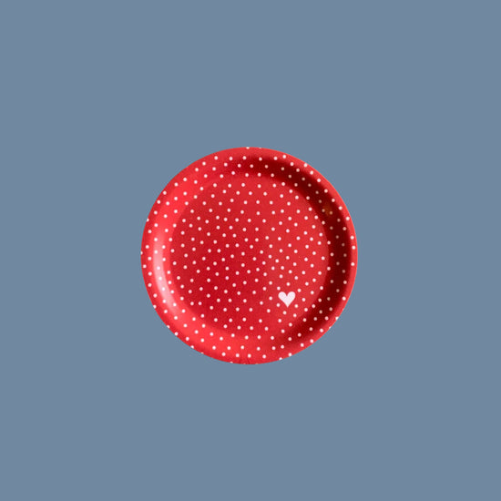 Vorderseite des Glasuntersetzers aus Holz mit Punkten rot vor mysblauem Hintergrund