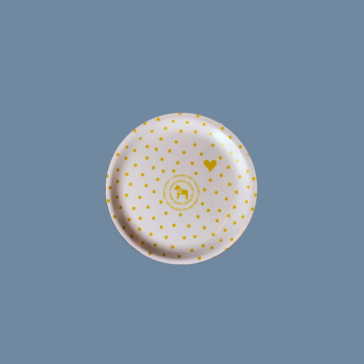 Rückseite des Glasuntersetzers aus Holz mit Punkten gelb vor mysblauem Hintergrund