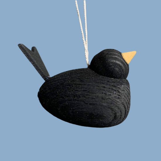 Vogel aus Holz mit Band in schwarz